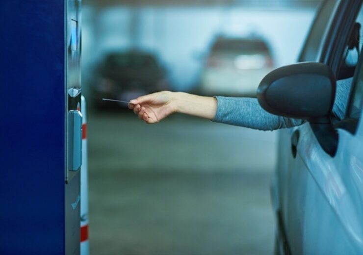 Parking,Lot,,Car,And,Hand,With,Ticket,Meter,For,Payment,