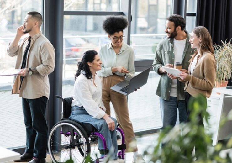 Cheerful,Interracial,Business,People,And,Disabled,Woman,In,Wheelchair,Using