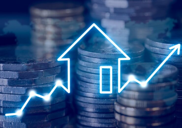 Stacks,Of,Coins,With,A,Glowing,House,Icon,And,Upward
