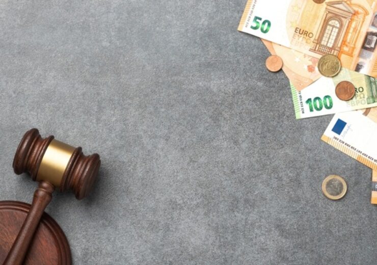 Wooden,Judge,Gavel,On,Euro,Banknotes,And,Coins,On,A