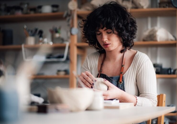 Portrait,Of,Serious,Focused,Pottery,Course,Attendee,Sitting,At,Ceramics