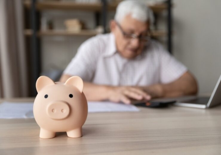 Ceramic,Pink,Piggy,Bank,Close,Up,On,Desk,Of,Elderly