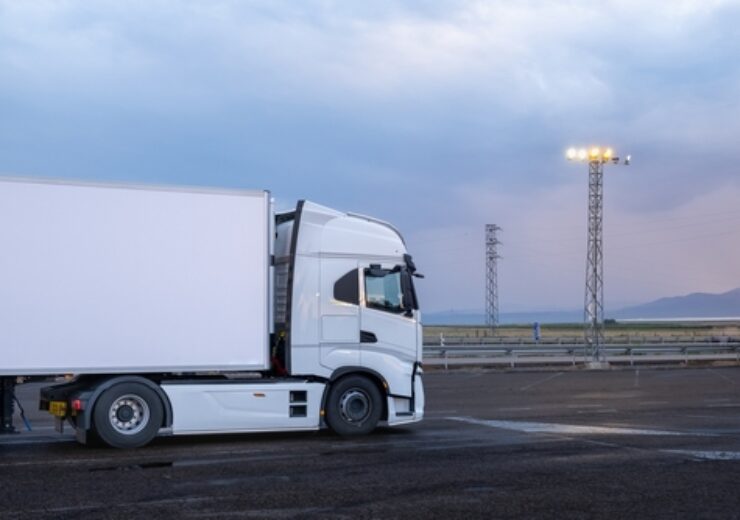 A,Big,White,Truck,Parked,At,A,Service,Station,At